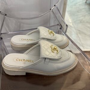 CHANEL White Quilted Mules with Gold Logo